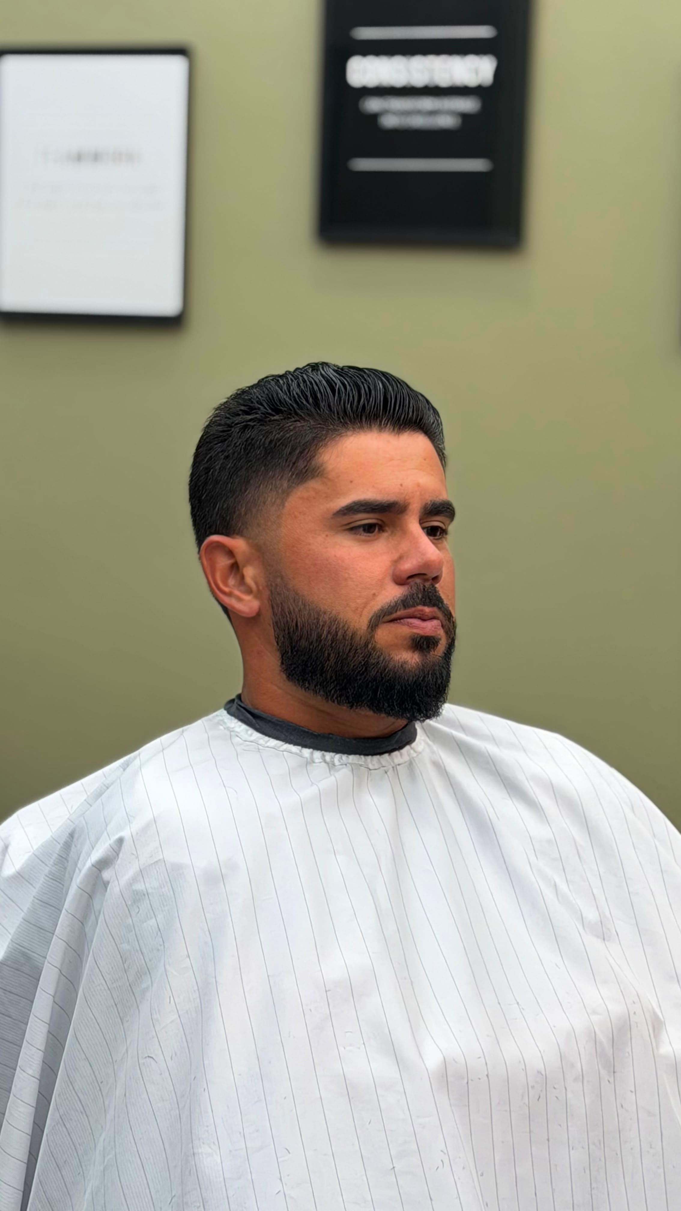 Men's haircut with fade and beard at WOLF Barbershop