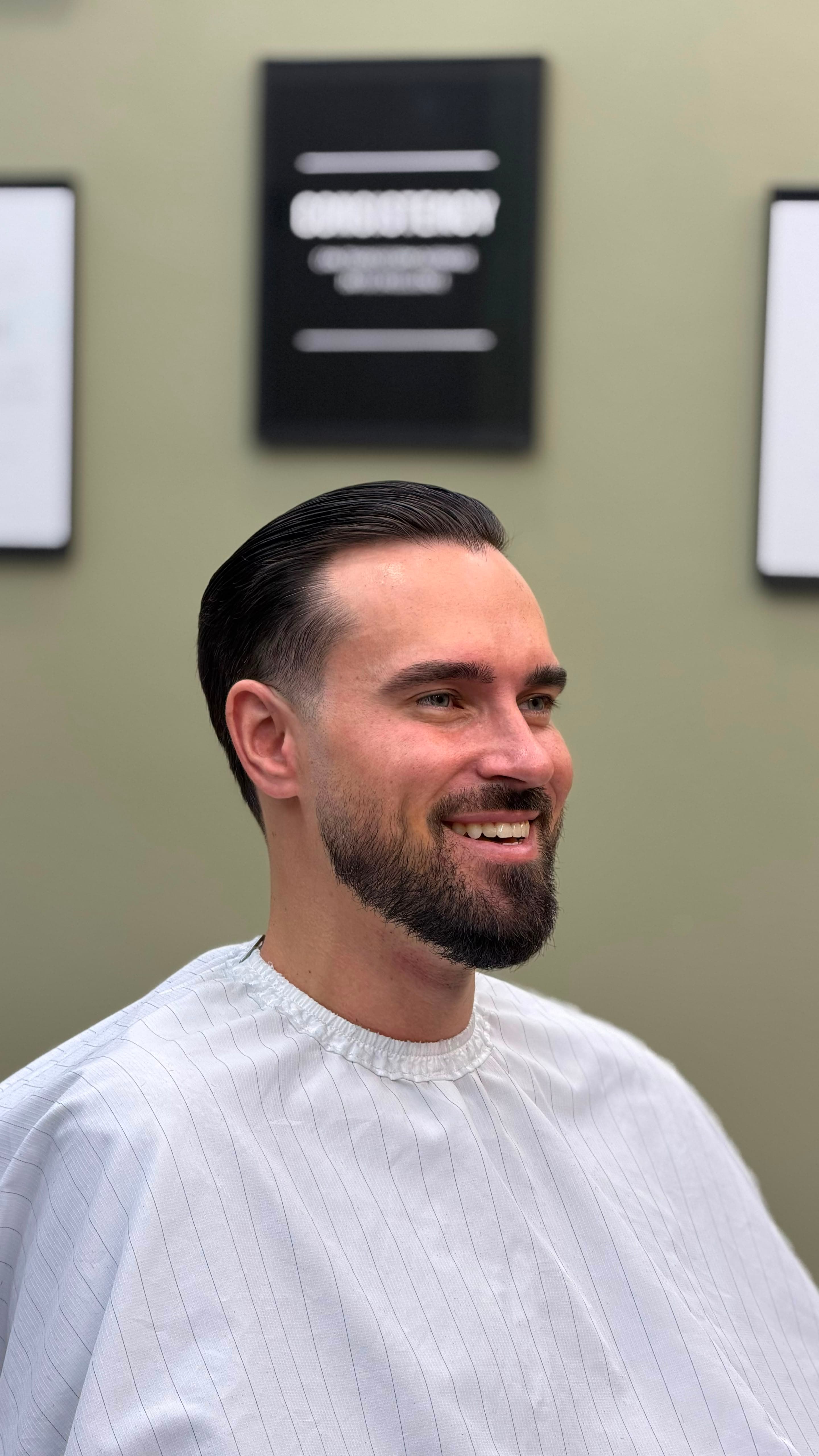 Men's haircut with fade and beard at WOLF Barbershop